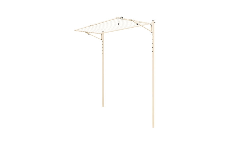 Austral Compact folding clothesline in Classic Cream, free-standing on an in-ground mount kit