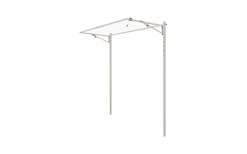 Austral Compact folding clothesline in Dune, free-standing on an in-ground mount kit