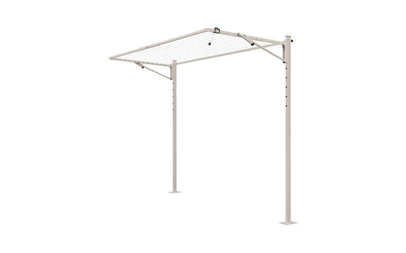 Austral Compact folding clothesline in Dune, free-standing on a plated ground mount kit for hard surfaces