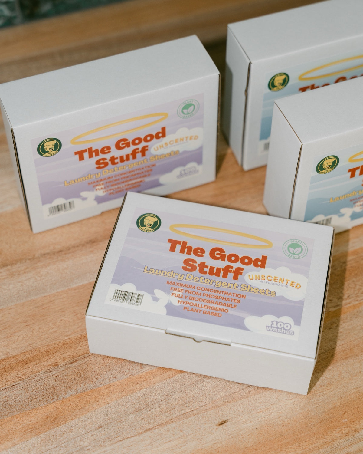 Boxes of The Good Stuff Laundry Sheets on a timber laundry bench