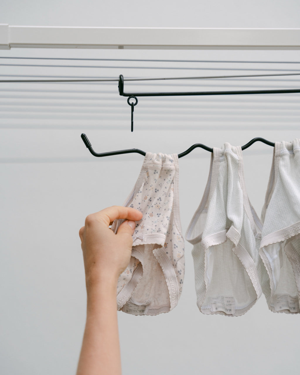 Sliding undies onto The Undie Hanger – no pegs needed