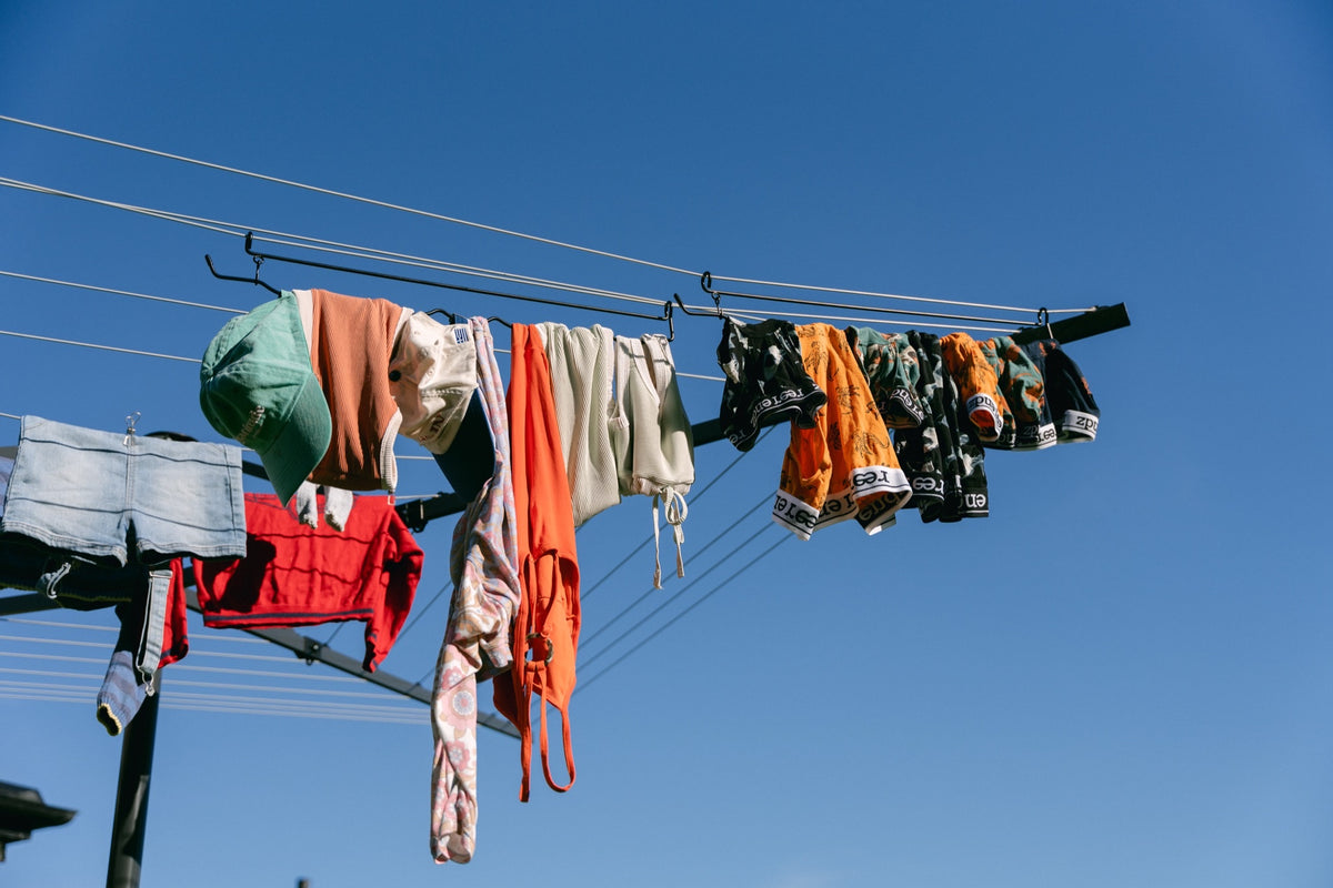 A fully loaded Undie Hanger of undies, bras and swimmers against a blue sky